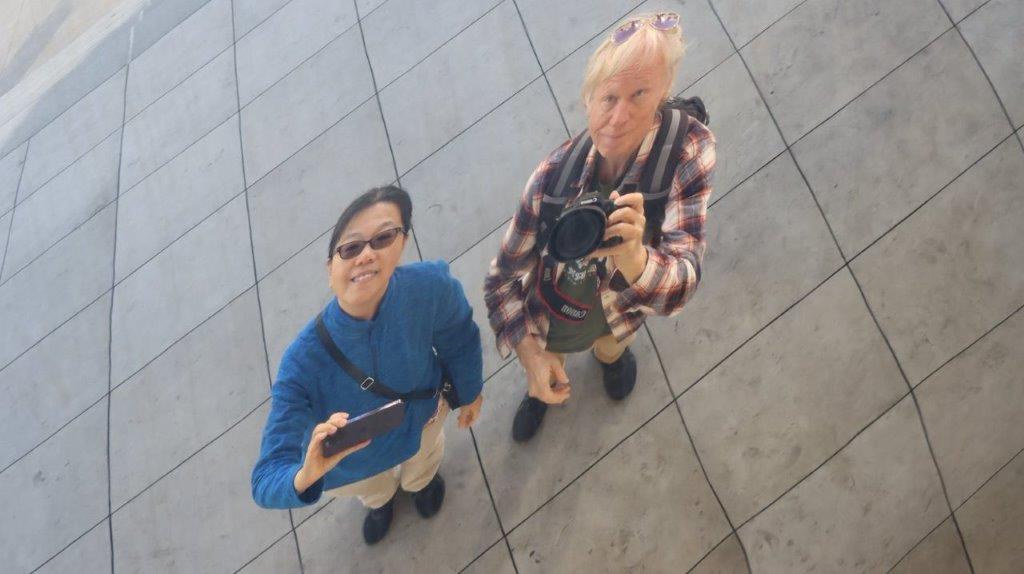 A couple of people taking a selfie

Description automatically generated