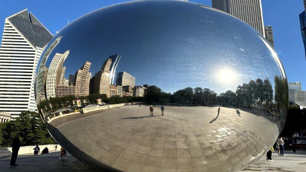 A reflection of Millennium Park in a reflective surface

Description automatically generated