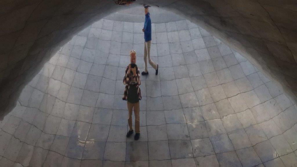 A person and person standing in a tunnel

Description automatically generated