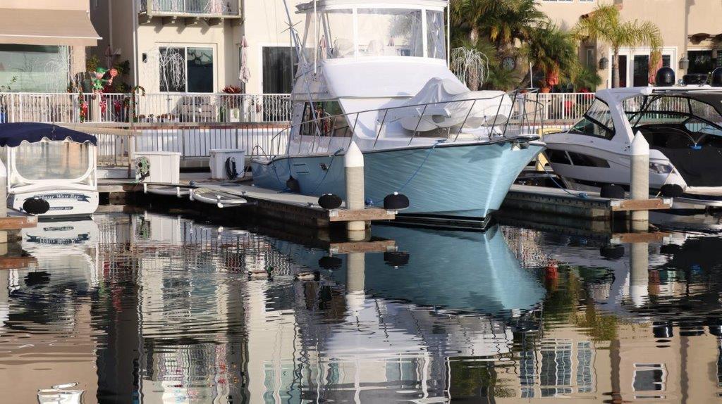 A boat docked in a body of water

Description automatically generated