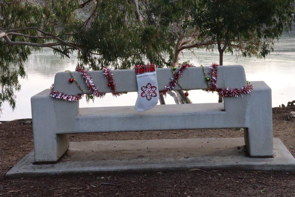 A white bench with a sock on it

Description automatically generated