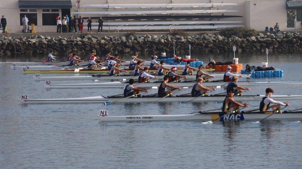 A group of people rowing on a river

Description automatically generated