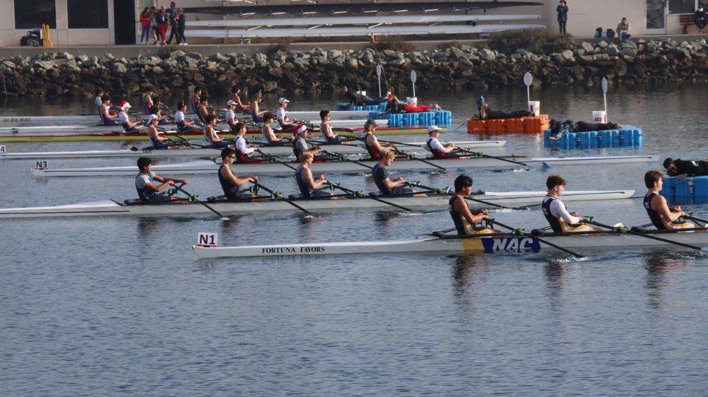 A group of people rowing on a river

Description automatically generated