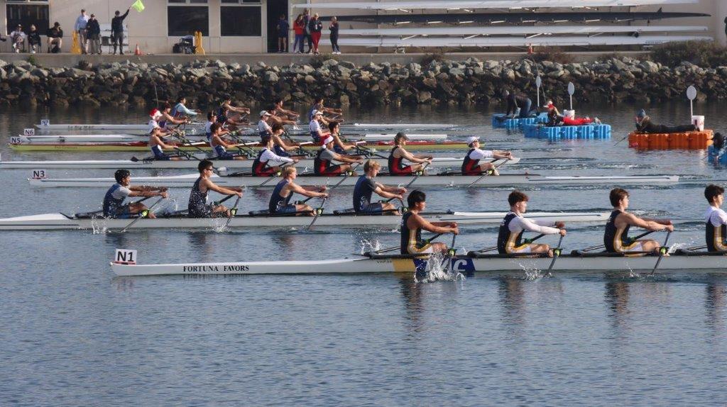 A group of people rowing on a river

Description automatically generated