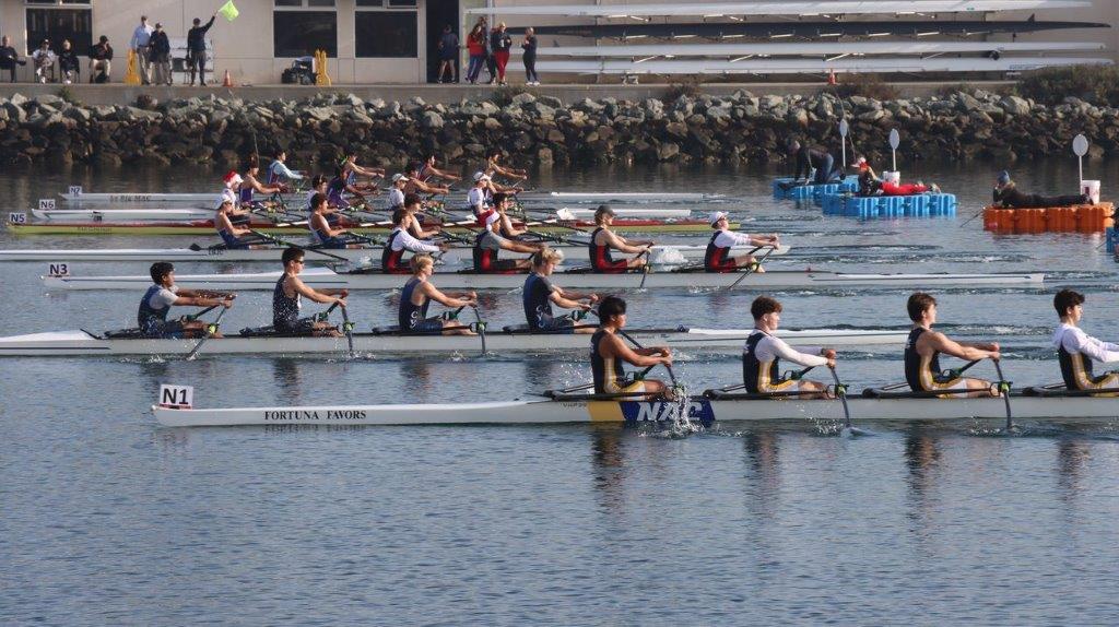 A group of people rowing on a river

Description automatically generated