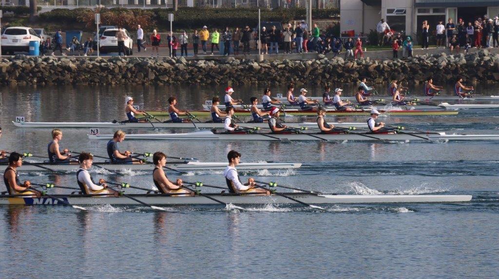 A group of people rowing on a river

Description automatically generated