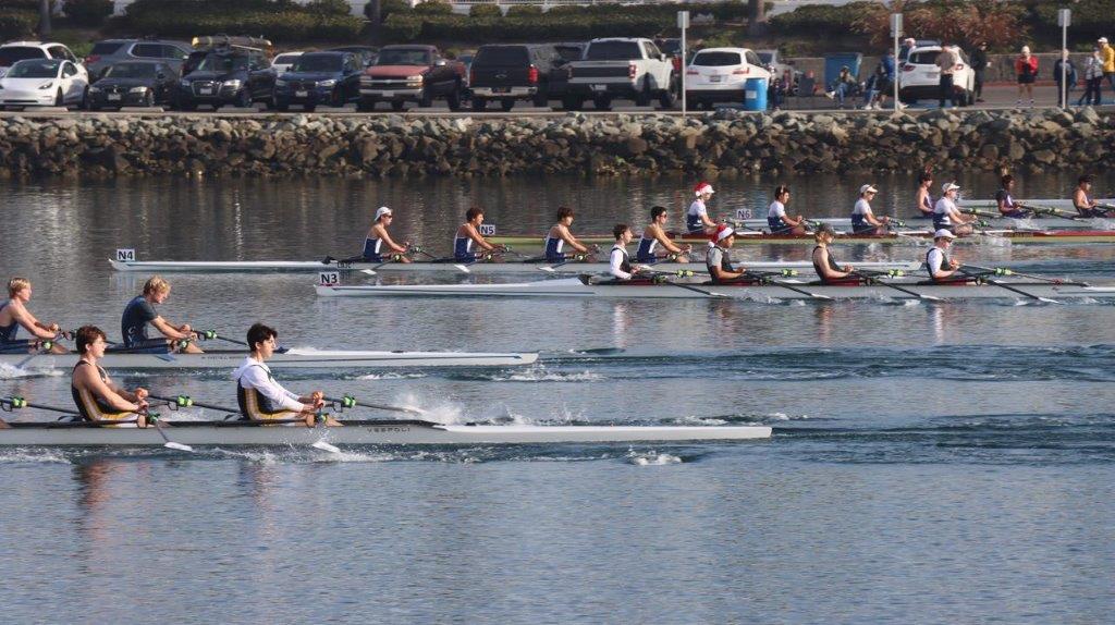 A group of people rowing on a river

Description automatically generated