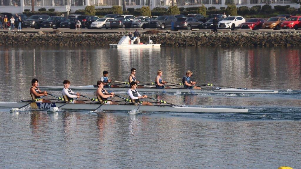 A group of people rowing on a river

Description automatically generated