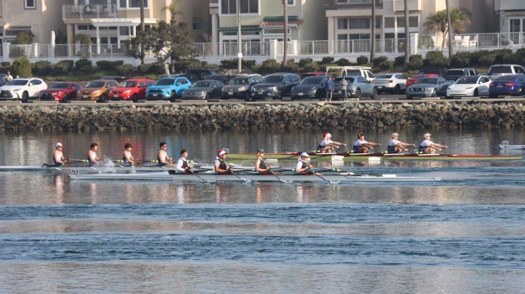 A group of people rowing on a river

Description automatically generated