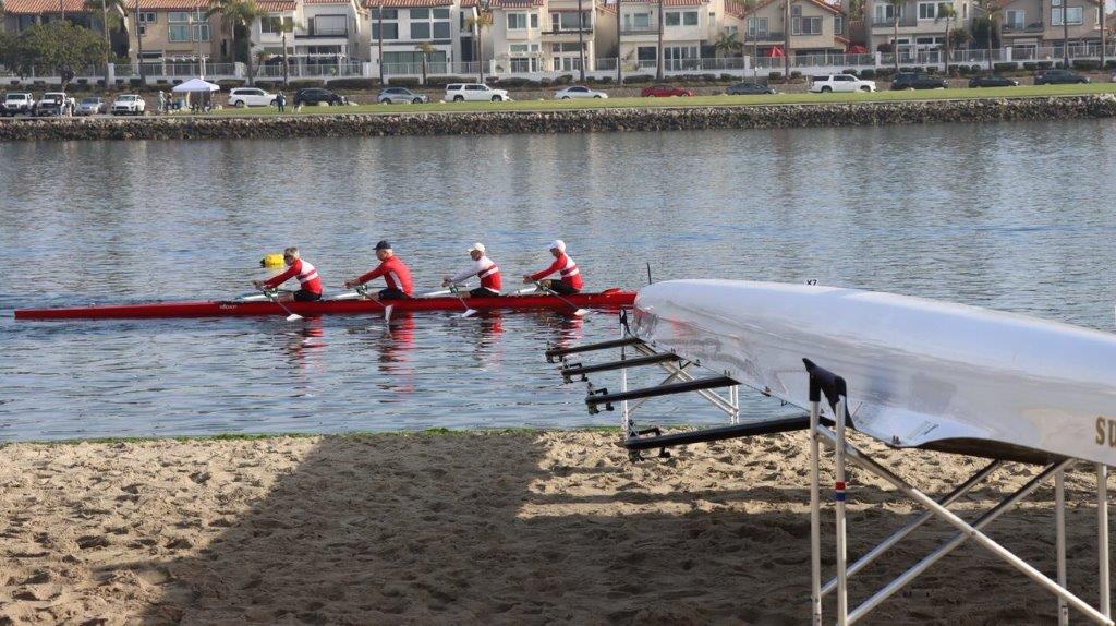 A group of people rowing on a river

Description automatically generated