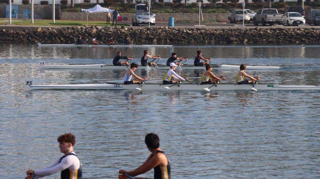 A group of people rowing on a river

Description automatically generated