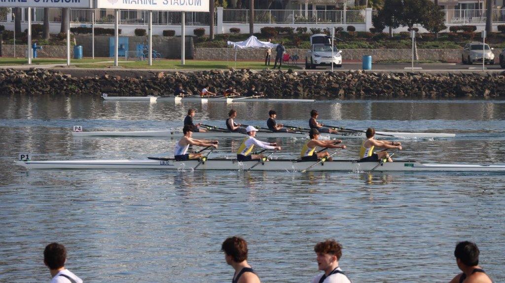 A group of people rowing on a river

Description automatically generated