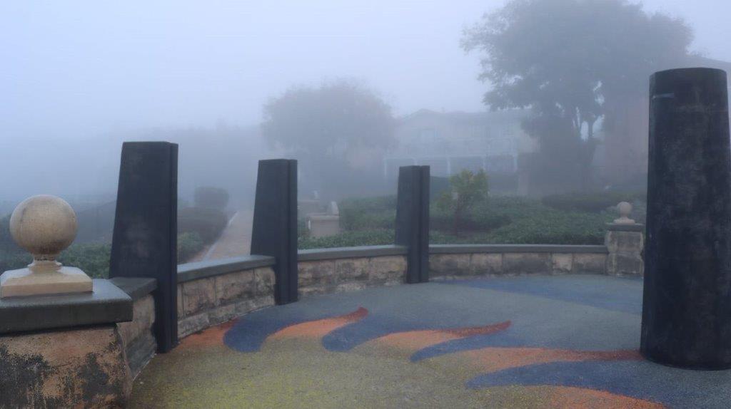 A foggy view of a patio

Description automatically generated