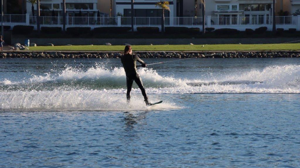 A person water skiing on the water

Description automatically generated