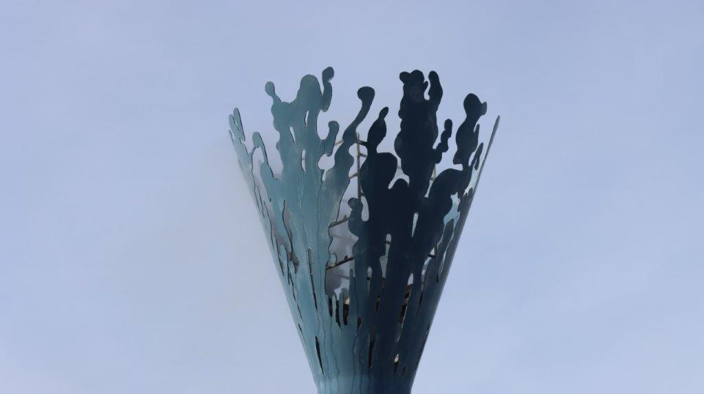 A sculpture of a torch

AI-generated content may be incorrect.