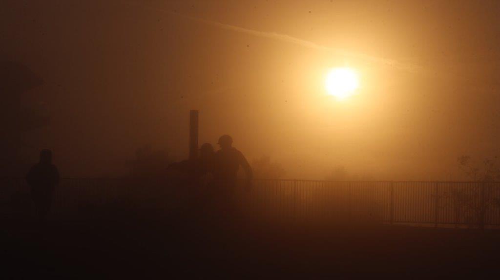 A silhouette of a person walking in the fog

AI-generated content may be incorrect.