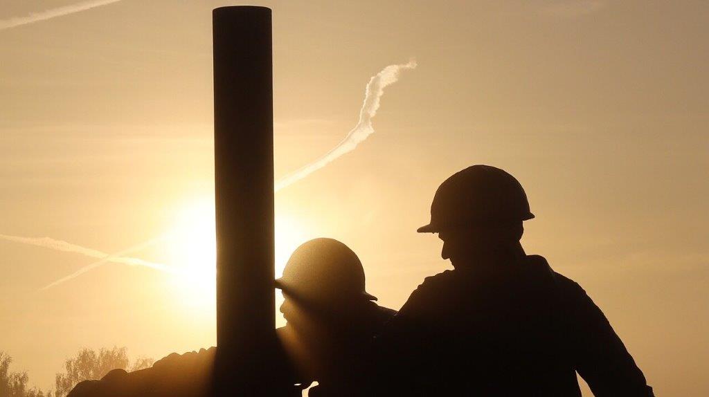 A silhouette of a few men wearing hard hats

AI-generated content may be incorrect.