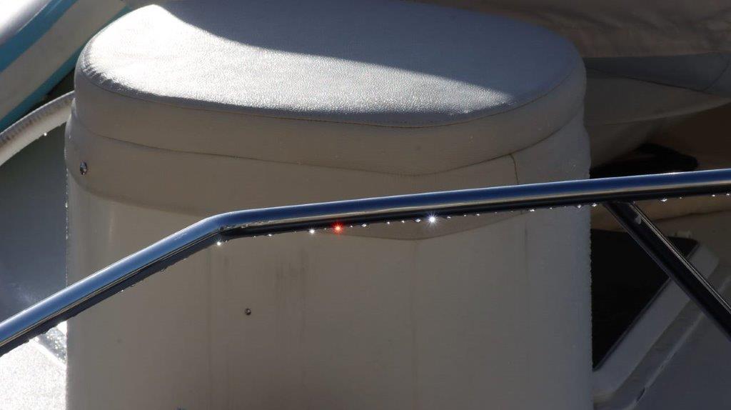 A close-up of a metal handrail

Description automatically generated