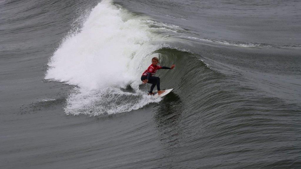 A person surfing on a wave

Description automatically generated