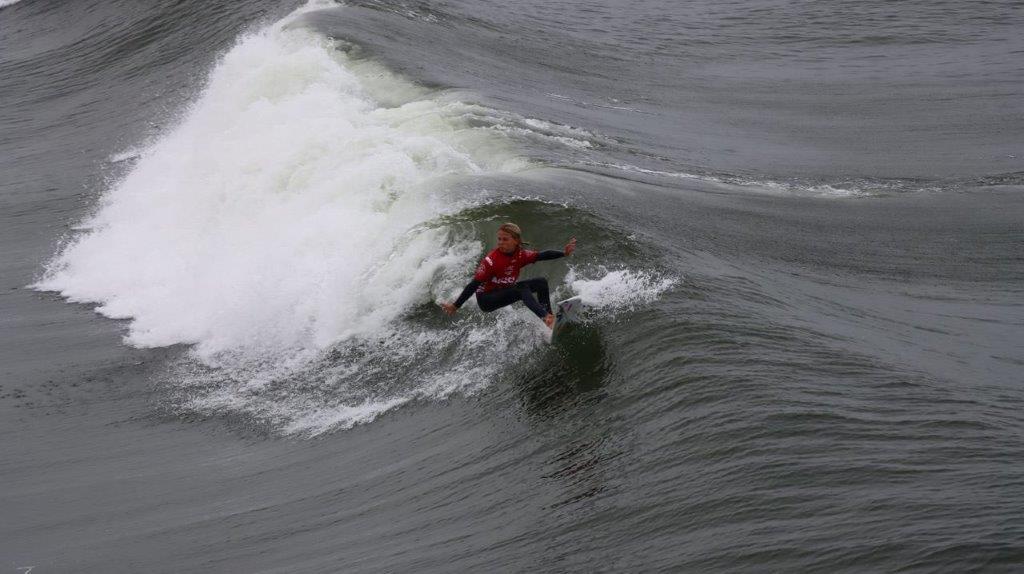 A person surfing on a wave

Description automatically generated