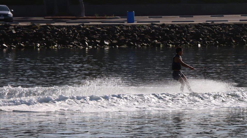A couple of people water skiing

Description automatically generated