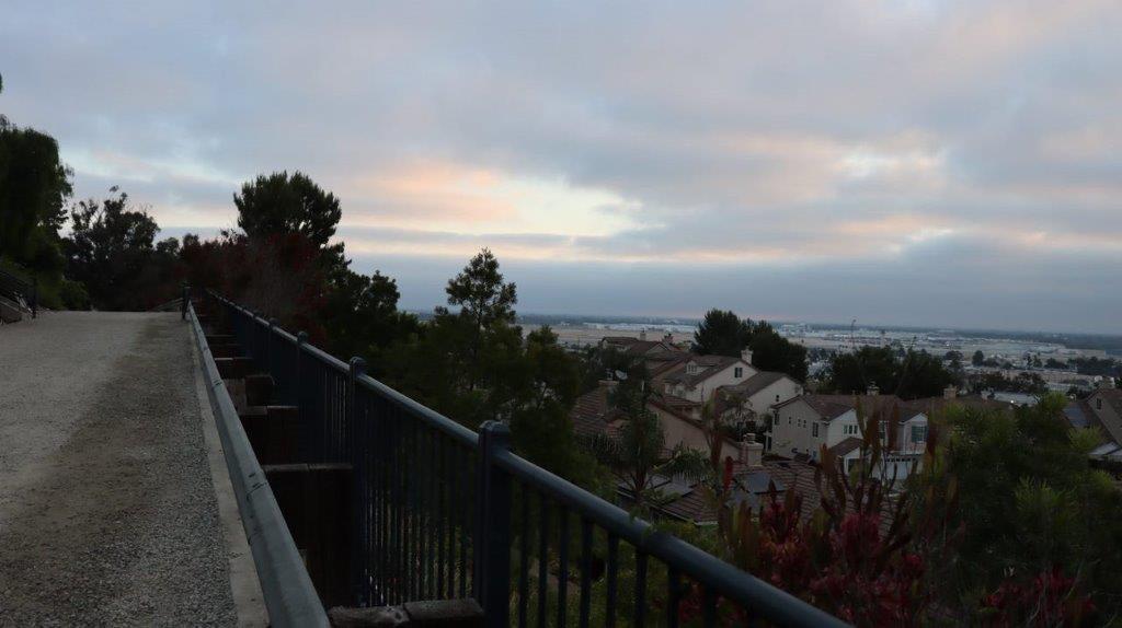 A railing and trees in the distance

Description automatically generated with medium confidence