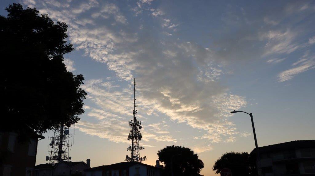 A silhouette of a building and trees

Description automatically generated