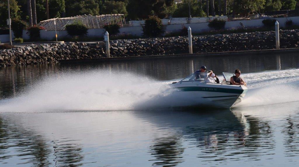 A speedboat driving on the water

Description automatically generated