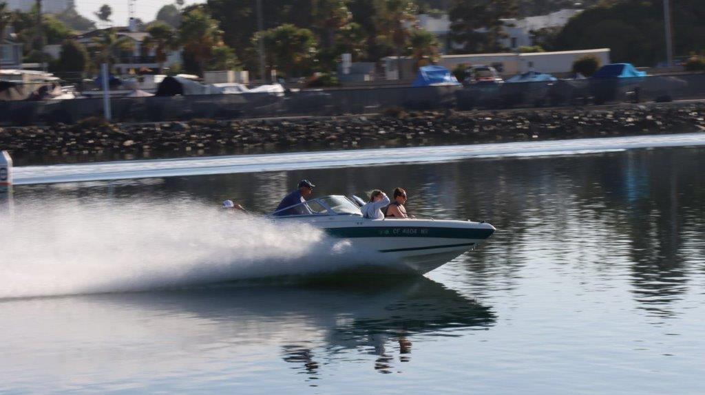 A group of people on a speedboat

Description automatically generated