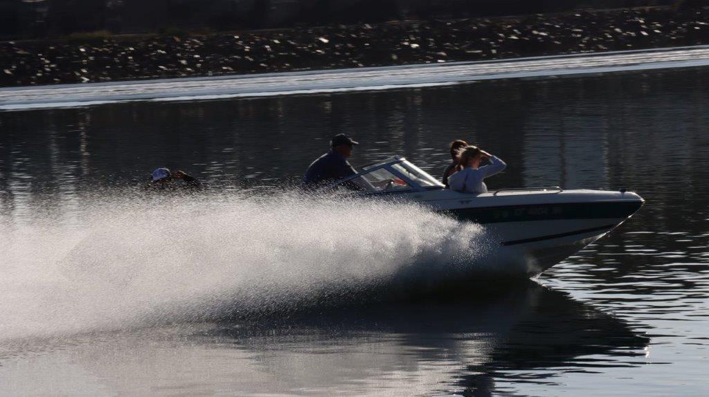 A speedboat driving through water

Description automatically generated