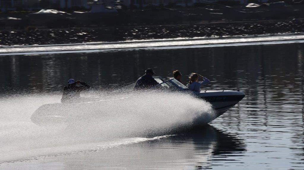 A group of people on a speedboat

Description automatically generated