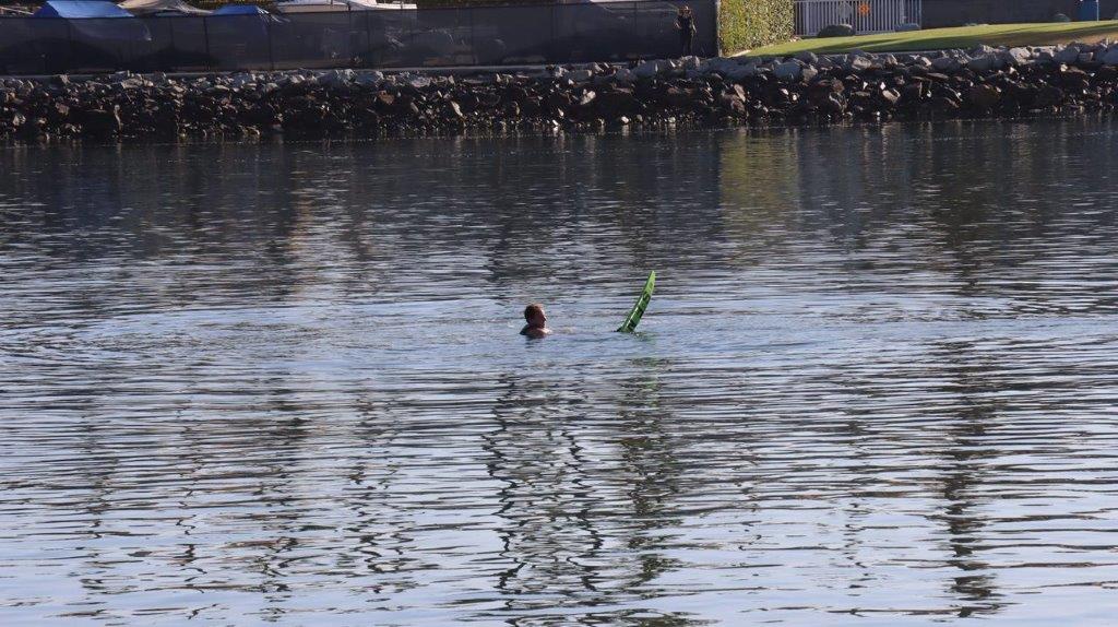 A person swimming in the water

Description automatically generated