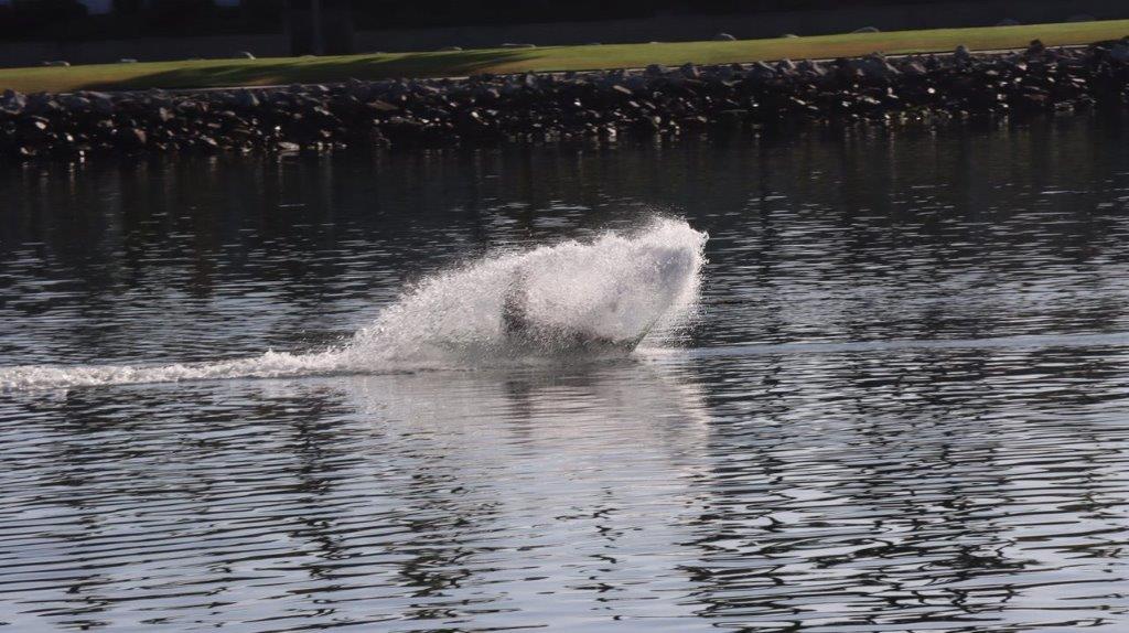 A person riding a jet ski

Description automatically generated