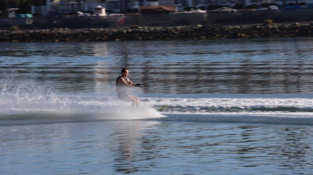 A person riding a water ski

Description automatically generated