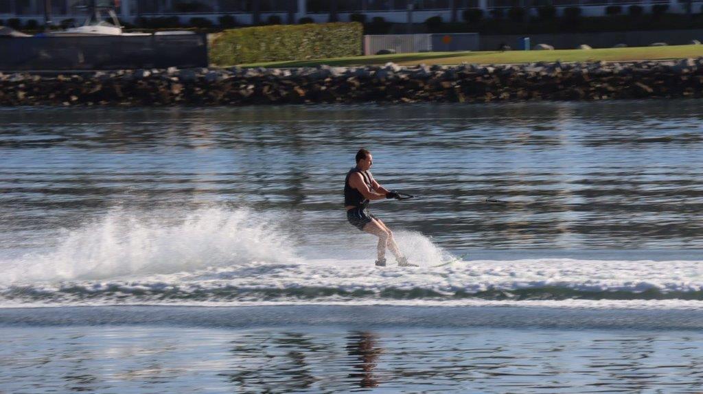 A person water skiing on the water

Description automatically generated