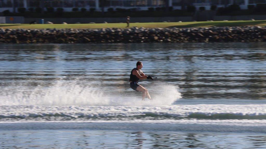 A person water skiing on the water

Description automatically generated