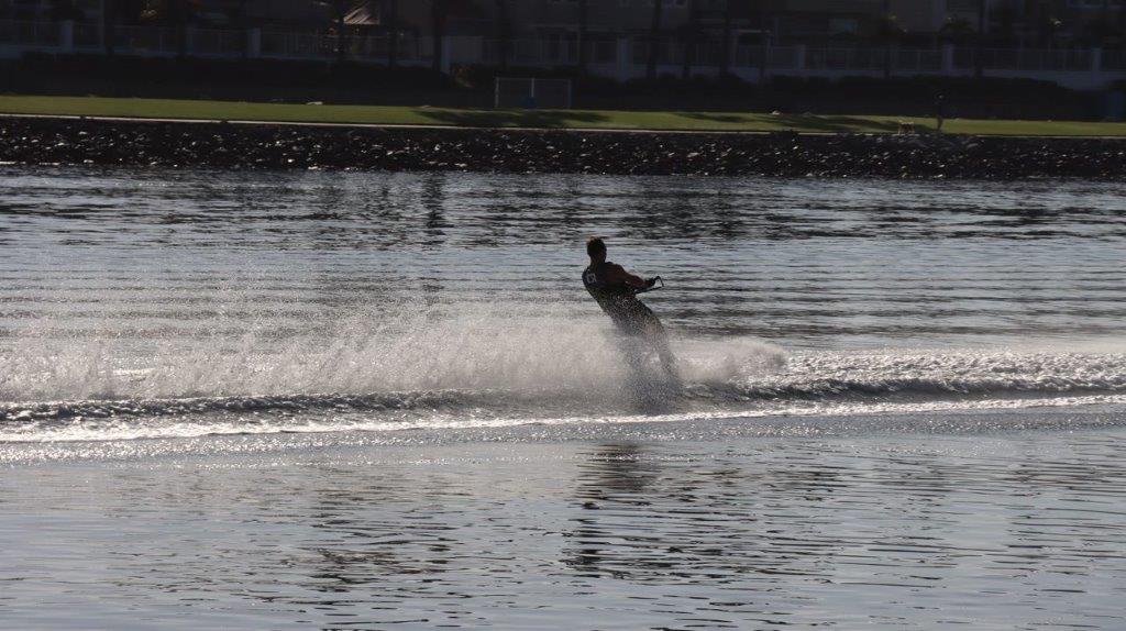 A person water skiing on the water

Description automatically generated