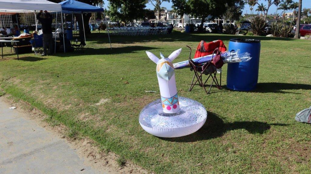 A white object on a float in a grassy area

Description automatically generated with medium confidence