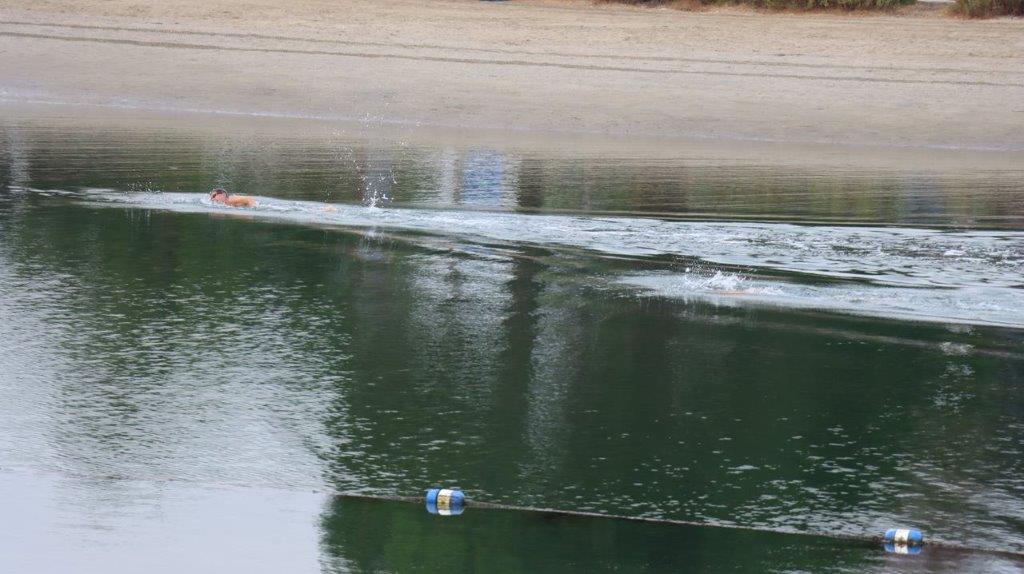 A person in a boat in the water

Description automatically generated