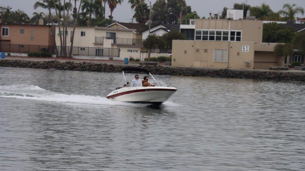 A speedboat driving through a body of water

Description automatically generated