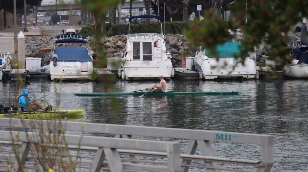 A person in a boat on the water

Description automatically generated