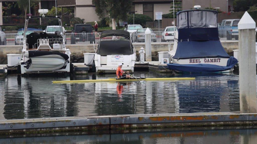 A person in a boat in the water

Description automatically generated