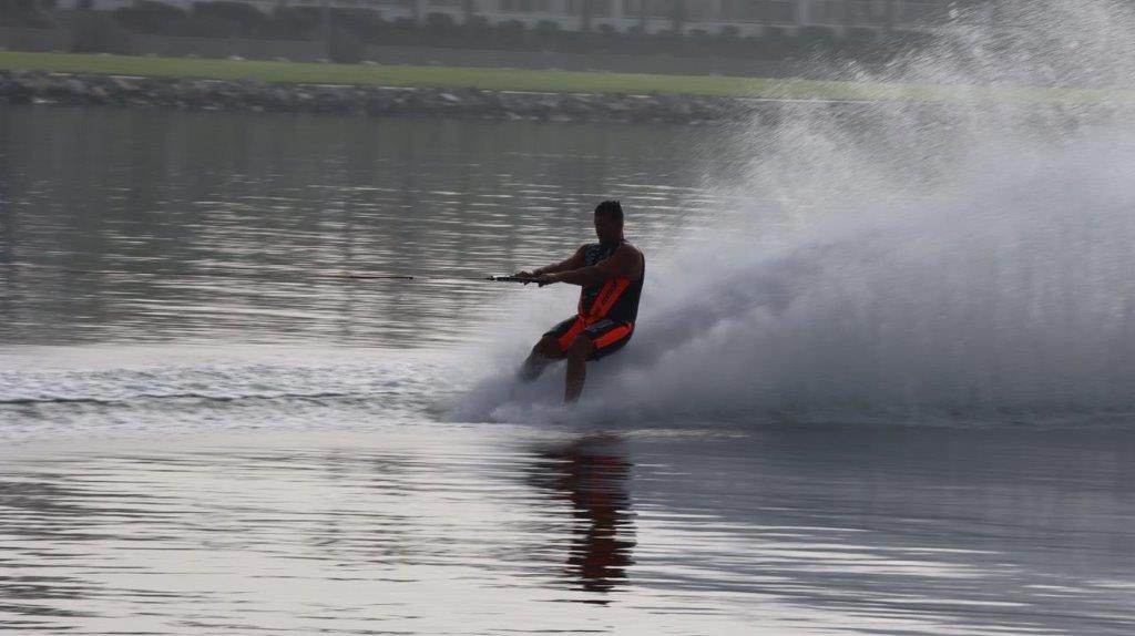 A person water skiing on the water

Description automatically generated