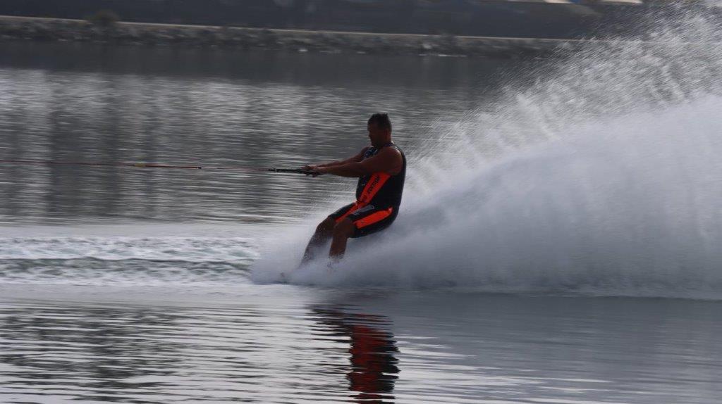 A person on a water ski

Description automatically generated